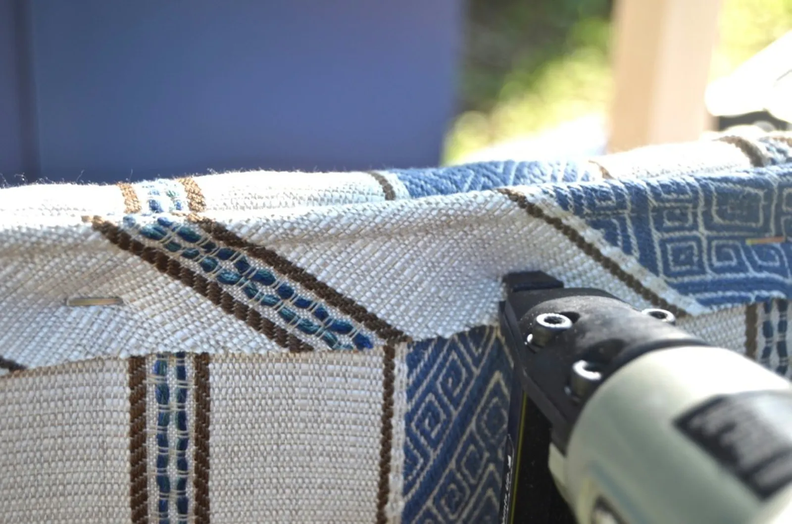 staple piping onto underside of upholstered bench