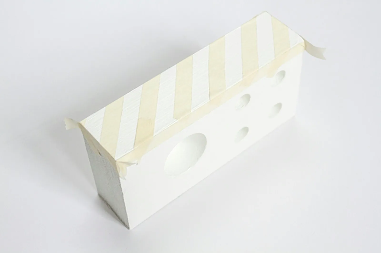 Give the block a bit of added personality by creating a design on the side with masking tape.