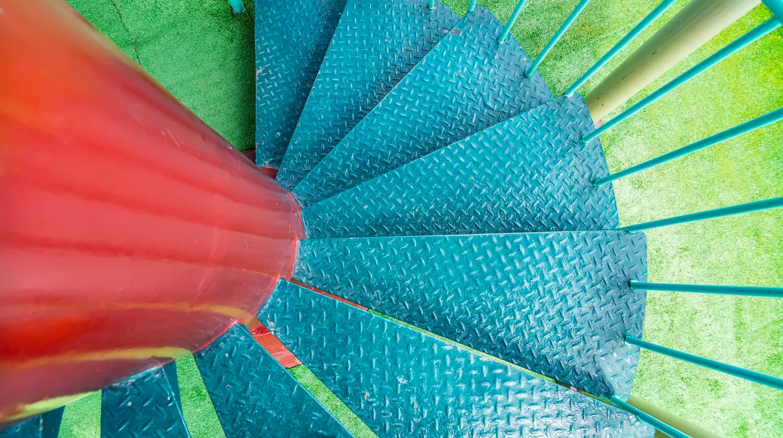 Old grungy wooden colorful spiral staircase exterior