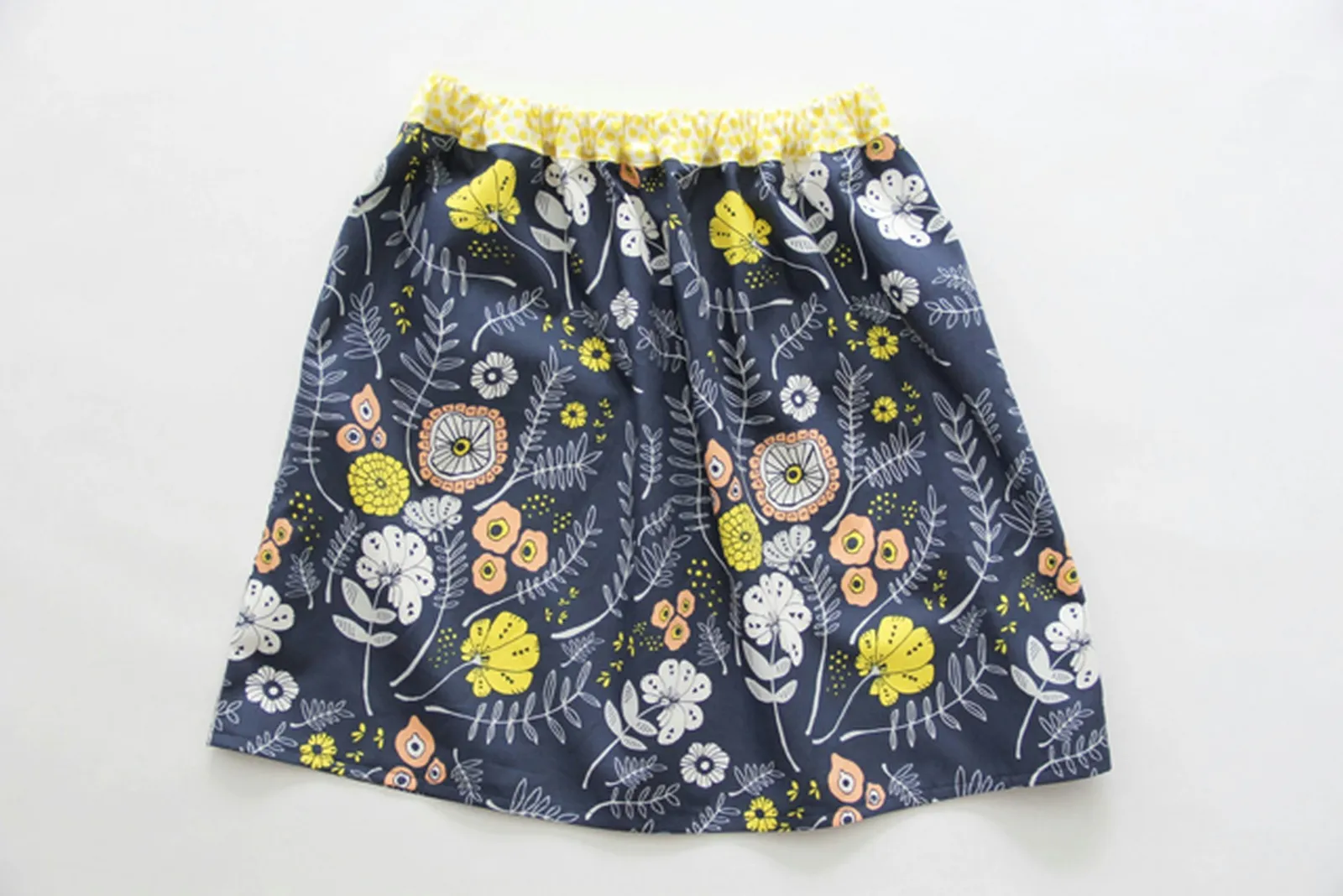 Sew an easy elastic waistband onto your gathered skirt