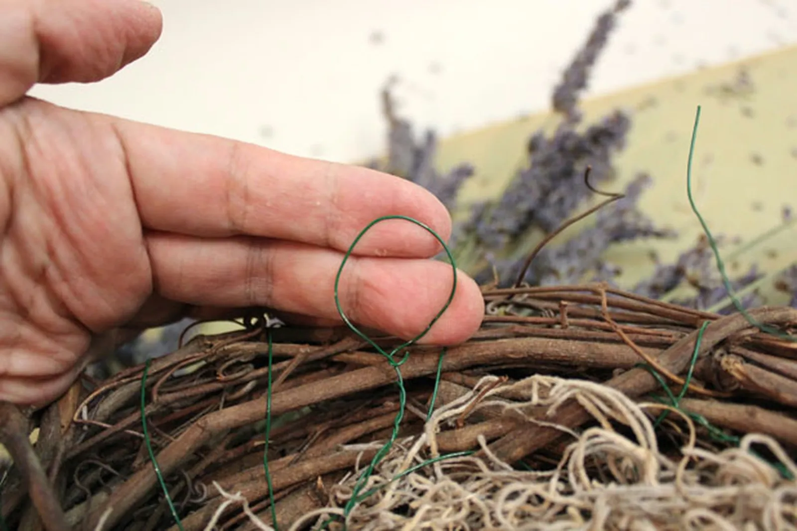 Tie a loop for hanging the wreath.