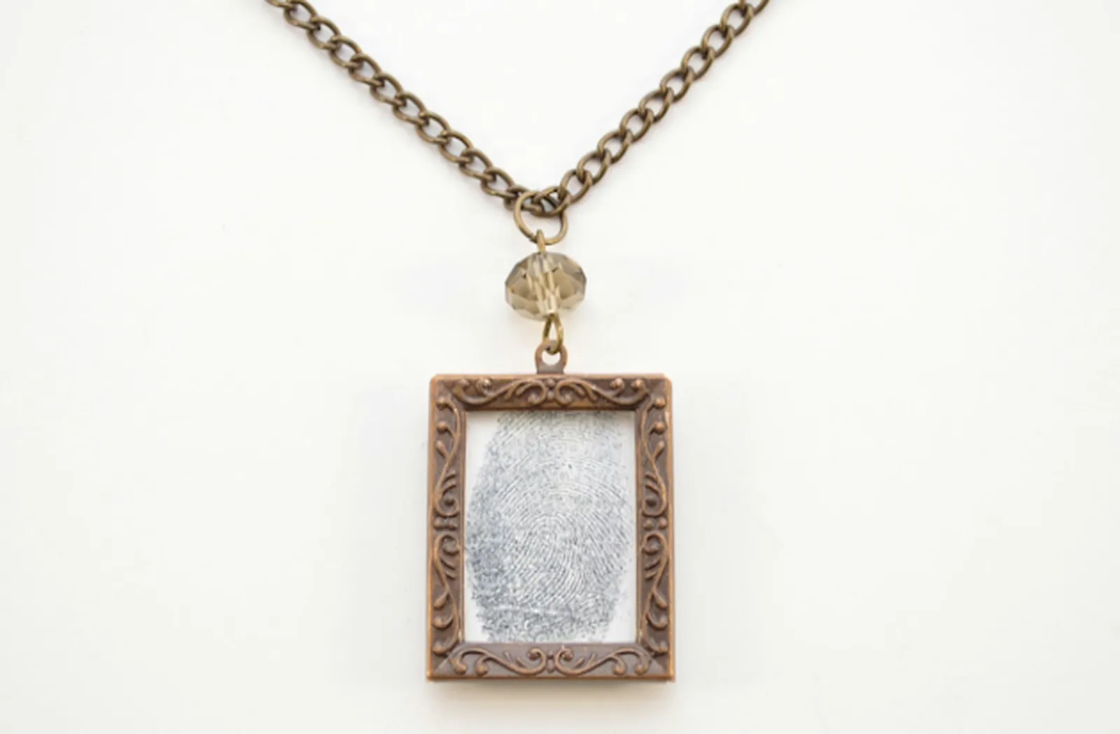 To finish your necklace, add the pendant to the chain.