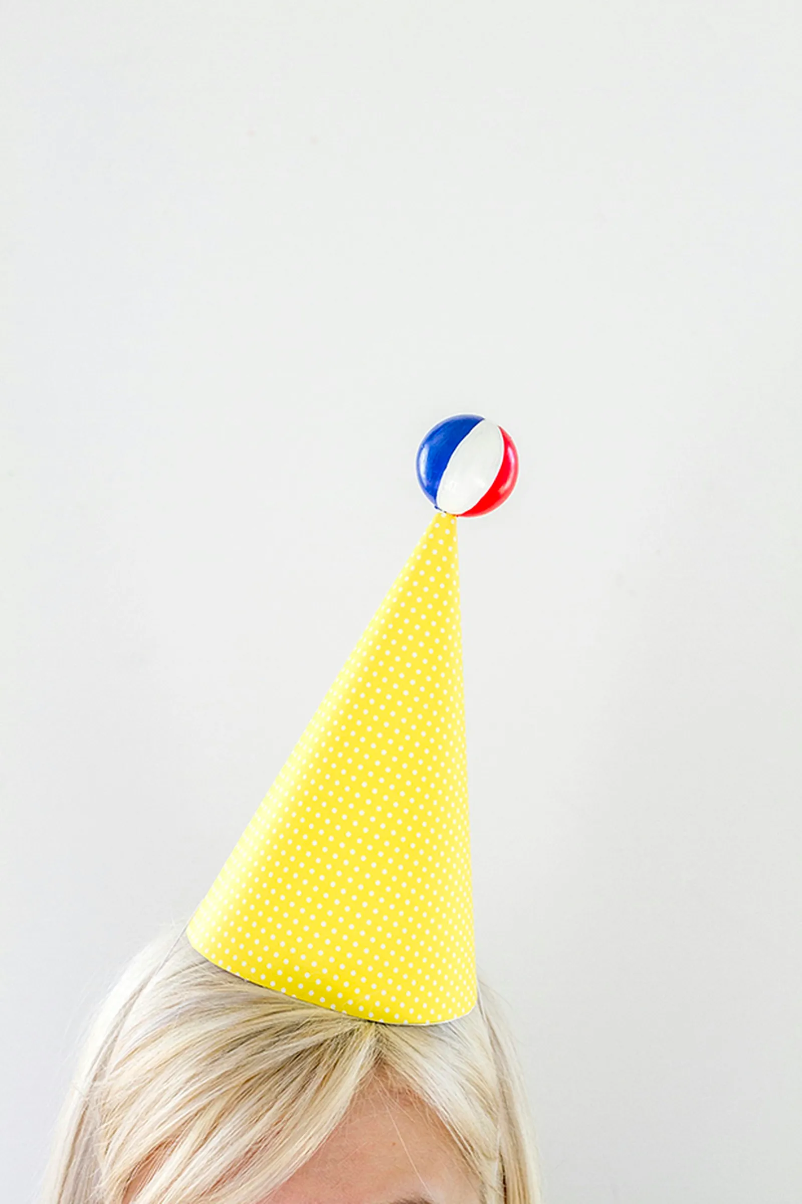 Wear the beach ball-topped hat with pride.