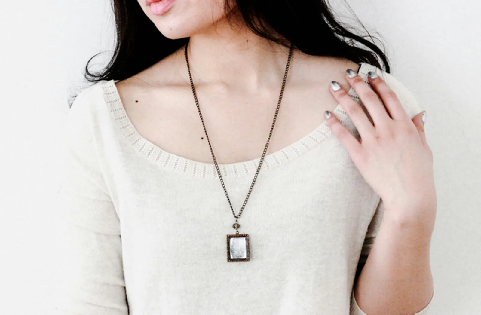 Frame pendants can be found on Etsy or in the jewelry section of your local craft store.