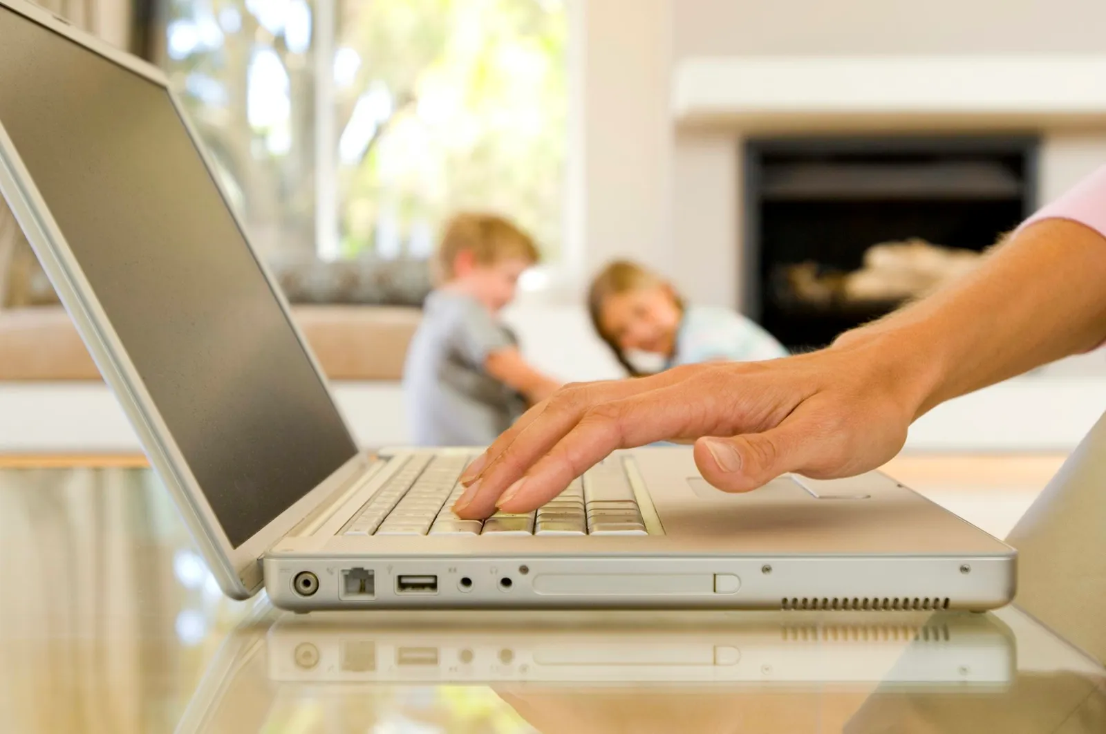 Hands of woman typing on laptop computer