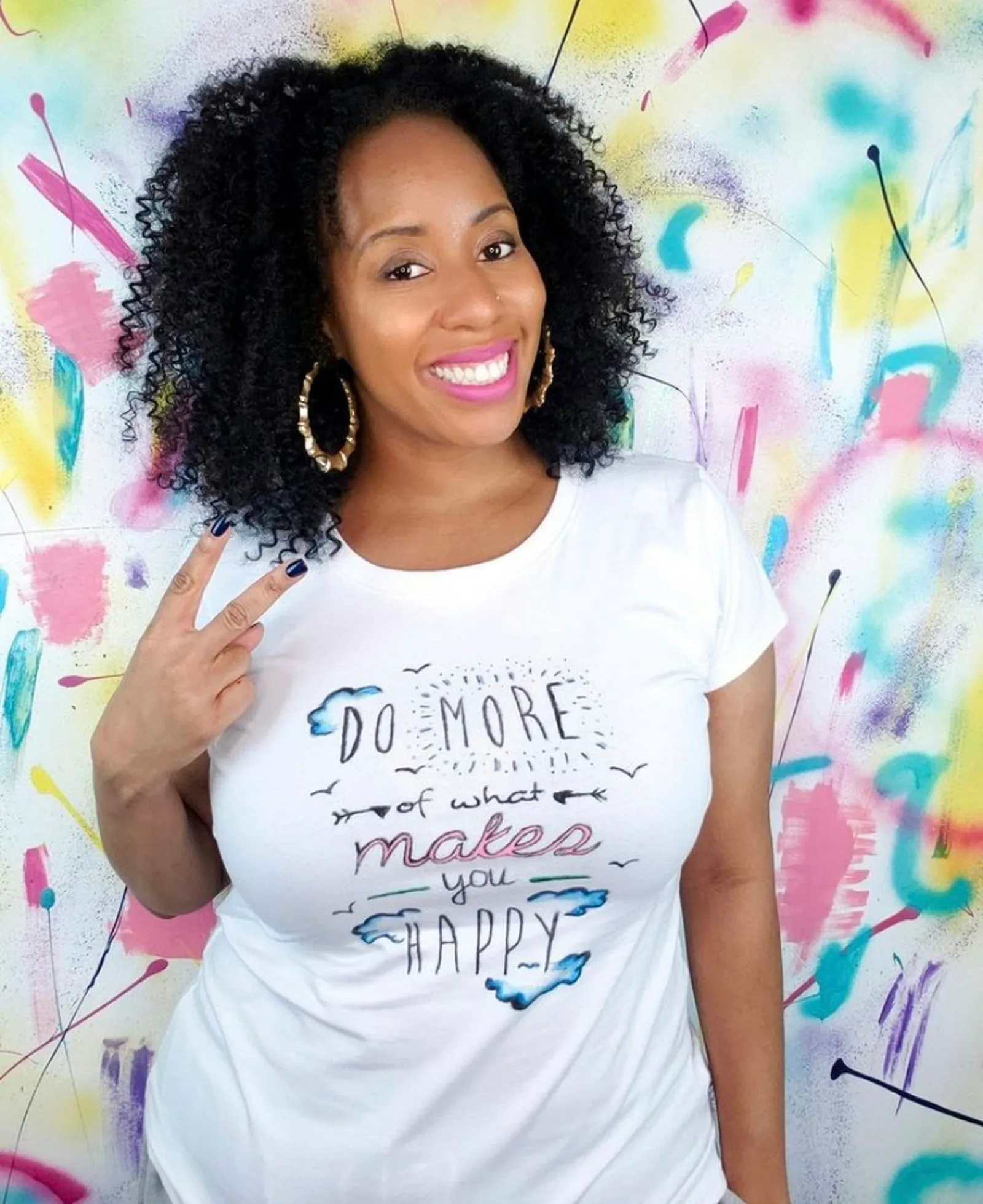 A.V. poses in a white t-shirt.