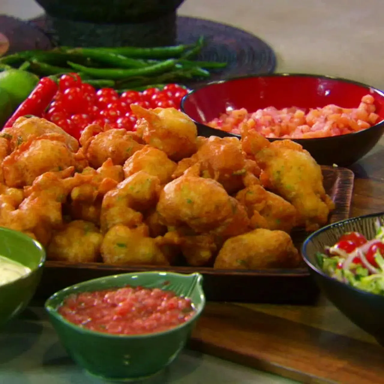 Salt Cod Fritters with Creamy Mustard Sauce, Spicy Orange Chili Sauce, Pineapple Chutney and Shredded Zucchini Salad